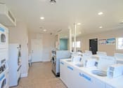 Thumbnail 31 of 33 - A laundry room with washers and dryers at A62 Apartments, Indianapolis