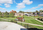 Thumbnail 21 of 33 - A skate park with a ramp and a fence at A62 Apartments, Indiana 46220