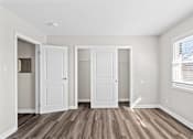 Thumbnail 20 of 32 - Three white doors are in a room with wood floors.