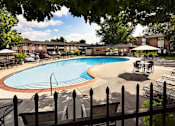 Thumbnail 32 of 32 - A pool surrounded by a black fence.