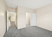 Thumbnail 36 of 54 - A room with a grey carpet and white walls.