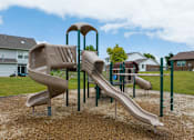 Thumbnail 27 of 40 - A playground with a slide and a climbing frame.