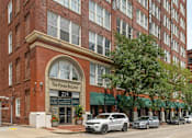 Thumbnail 1 of 44 - A street view of a building with the sign