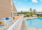 Thumbnail 29 of 46 - A house with a pool and a deck.