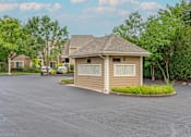 Thumbnail 46 of 46 - a small building in a parking lot with trees in the background at Enclave, Beavercreek, Ohio