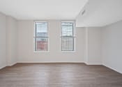 Thumbnail 35 of 49 - A room with two windows and a wooden floor at Sky Central Apartments, Cincinnati, 45202