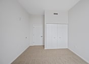 Thumbnail 36 of 49 - A white room with a white door and a white cabinet at Sky Central Apartments, Cincinnati