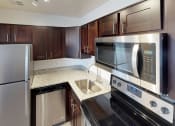 Thumbnail 12 of 34 - Modern stainless steel appliances at Woodlee Terrace Apartments, Woodbridge, VA