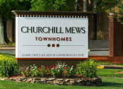 Thumbnail 5 of 18 - Placard with the Churchill Mews logo near apartments entrance