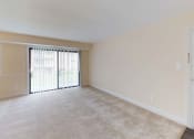 Thumbnail 13 of 18 - View of large living room area in apartment building with carpeting at Gainsborough Court Apartments, Fairfax, VA, 22030