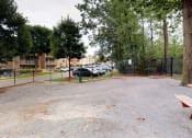Thumbnail 16 of 18 - Outdoor park area for residents with benches at Gainsborough Court Apartments, Fairfax, Virginia