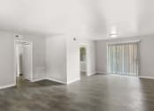 Thumbnail 28 of 69 - the living room and dining room of an empty house with white walls