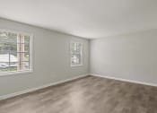 Thumbnail 45 of 69 - the living room of an apartment with wood flooring and a window