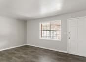 Thumbnail 26 of 69 - an empty bedroom with a window and a door