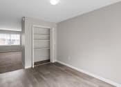 Thumbnail 65 of 69 - an empty bedroom with a closet and a window