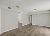 Thumbnail 34 of 69 - the living room of an empty apartment with white walls and wood flooring