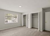 Thumbnail 38 of 69 - an empty bedroom with two closets and a window