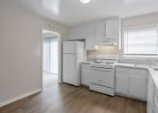Thumbnail 60 of 69 - the preserve at ballantyne commons apartment kitchen with white appliances and white cabinets