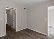 Thumbnail 50 of 69 - an empty room with a hallway and a door to a bedroom