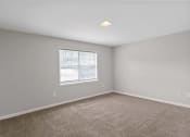 Thumbnail 64 of 69 - an empty room with carpet and a window