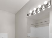 Thumbnail 24 of 69 - a bathroom with a sink and a mirror and a toilet
