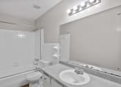 Thumbnail 67 of 69 - the preserve at ballantyne commons apartment bathroom with sink toilet and shower