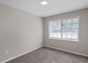 Thumbnail 59 of 69 - an empty room with carpet and a window