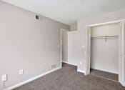 Thumbnail 56 of 69 - an empty bedroom with a closet and an open door
