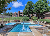 Thumbnail 24 of 37 - A pool with a fountain in the middle of it.