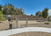 Thumbnail 19 of 20 - a fenced in area with a chain link fence and a parking meter