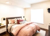 Thumbnail 12 of 20 - a bedroom with a large bed and a window