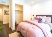 Thumbnail 14 of 20 - a bedroom with a bed and a closet