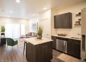 Thumbnail 7 of 20 - an open floor plan with a kitchen and living room