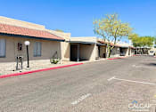Thumbnail 17 of 18 - A sunny day at the Calcap properties with a clear blue sky.
