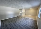 Thumbnail 14 of 27 - A room with a grey floor and white walls.