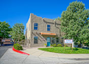 Thumbnail 20 of 28 - A building with a sign that says "Las Rivas" is in front of a tree.