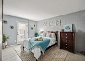 Thumbnail 8 of 23 - A bedroom with a bed, dresser, and wall art.