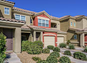 Thumbnail 16 of 20 - A row of houses with brown and tan exteriors.