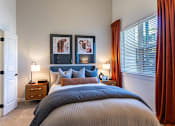Thumbnail 9 of 21 - a bedroom with a bed and a windowat Sterling Nashville West Apartments, Tennessee, 37209