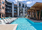 Thumbnail 1 of 21 - A swimming pool in front of a modern apartment buildingat Sterling Nashville West Apartments, Tennessee
