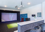 Thumbnail 18 of 21 - a room with a desk and a projection screenat Sterling Nashville West Apartments, Nashville