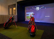 Thumbnail 19 of 21 - a display of golf clubs and bags in front of a screen at Sterling Nashville West Apartments, Nashville, TN, 37209