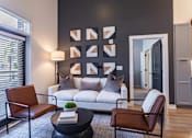 Thumbnail 3 of 21 - a living room with a couch and a table at Sterling Nashville West Apartments, Nashville, TN, 37209