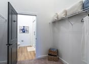Thumbnail 7 of 21 - a bedroom with a closet and a door to a bathroomat Sterling Nashville West Apartments, Tennessee
