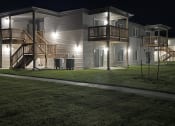 Thumbnail 11 of 16 - a building with lights on at night