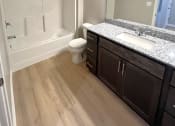 Thumbnail 3 of 16 - Phase 2 bathrooms with solid surface countertops in bathrooms and kitchen