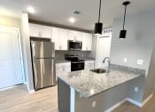 Thumbnail 1 of 16 - brand new kitchen with granite counter tops and stainless steel appliances