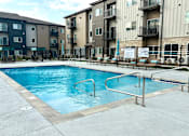 Thumbnail 14 of 35 - a swimming pool in the middle of an apartment building