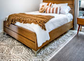 Thumbnail 9 of 35 - a bedroom with a bed and a window