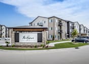Thumbnail 1 of 35 - The Reserve ON77 is a modern apartment complex with a clean and well-maintained exterior.